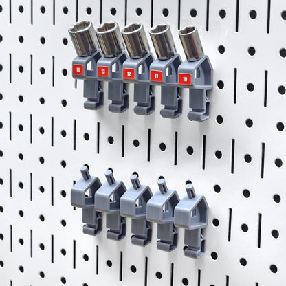 Multiple TROPEK™ 101 Brackets installed on a Wall Control™ panel, forming an organized socket collection.