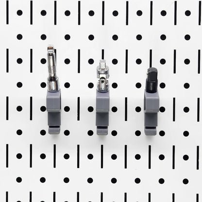 TROPEK™ 101 Brackets with 1/4" drive adapters snapped onto a Wall Control™ panel.