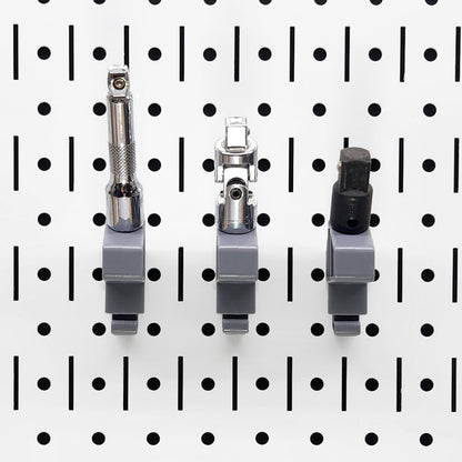 TROPEK™ 102 Brackets securely holding socket extensions on a pegboard panel.