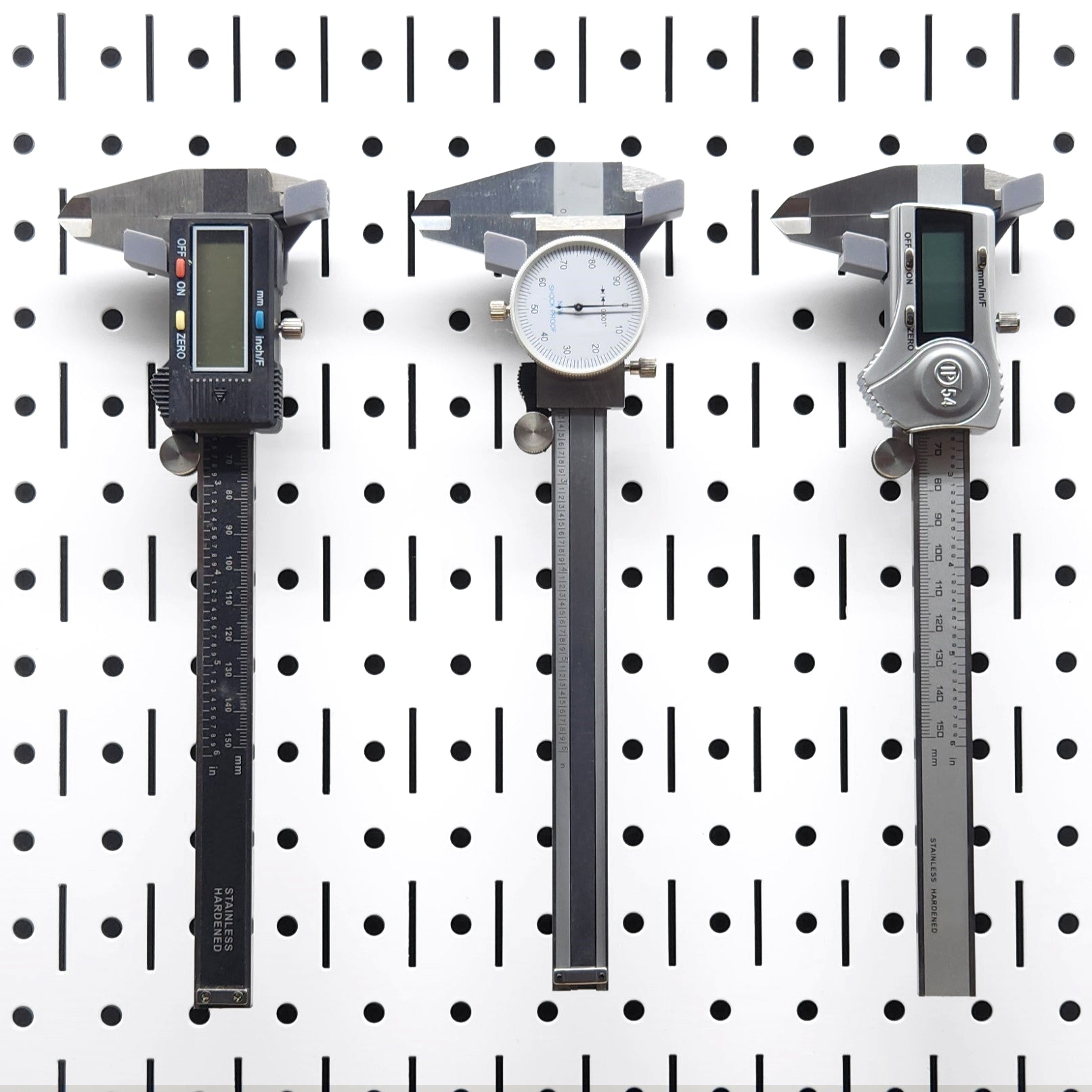 TROPEK™ 116 Brackets showing secure placement of calipers on a pegboard.