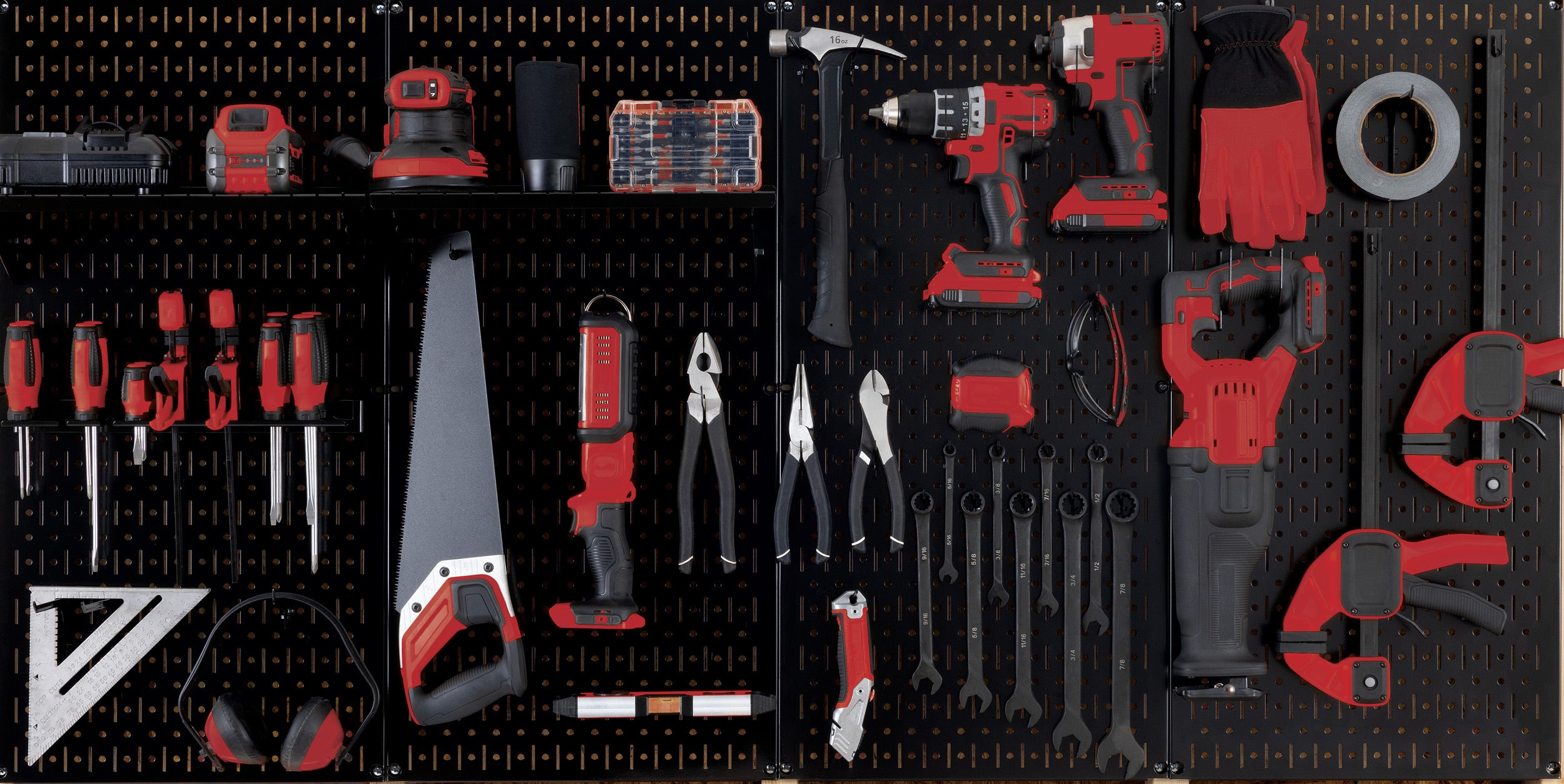 Collection of tools on a black Wall Control pegboard background